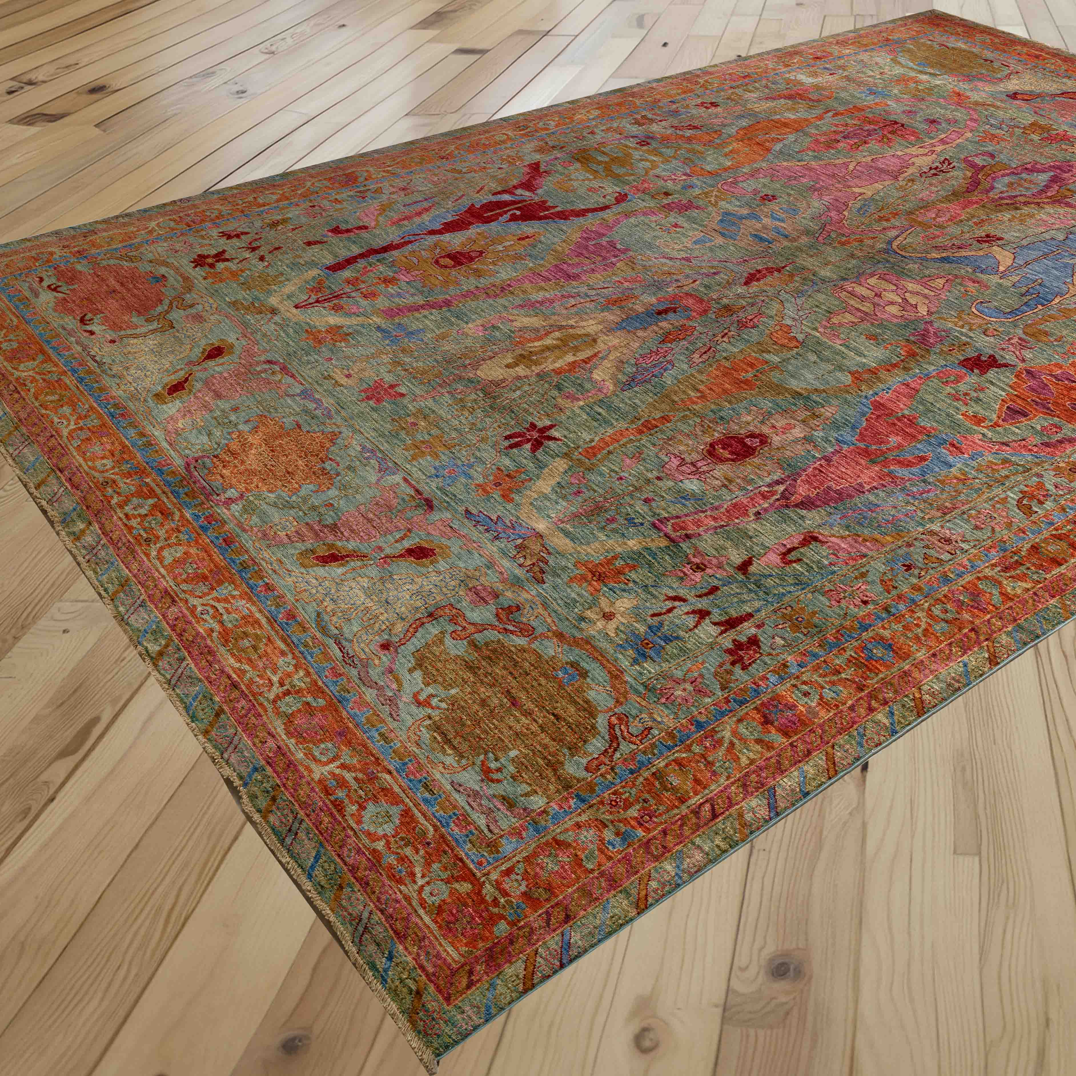 A vintage-style area rug with an intricate multicolour abstract and medallion pattern, shown laid out on a light-coloured surface to best effect.