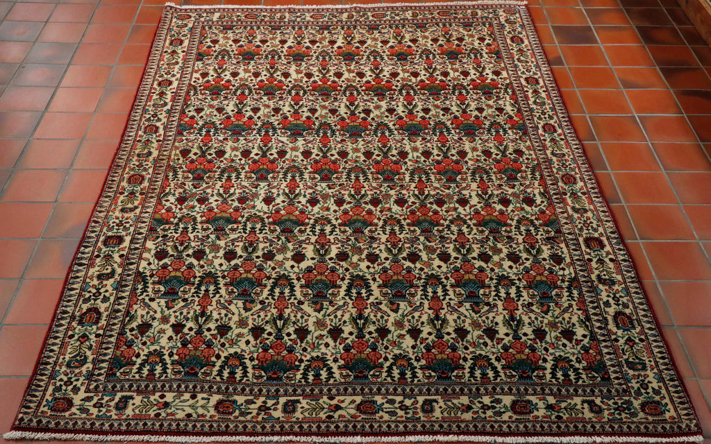 This Ghiasabad has a predominantly cream main ground and border with a complex pattern of flora, fauna and birds throughout it.  The colour pattern used in the decoration is red, red/pink, French blue, apple green and dark green.  The rug has a deep red edge to it which is picked out throughout the pattern work. 