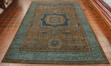 Extremely detailed decorative piece with intricate decoration across the entire rug.  The central dark blue medallion contains inner decoration using shades of lighter blue, browns and greens.  There is a broad band of decoration that is predominantly the lighter blue.  